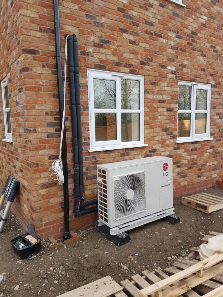 air source heat pump under window